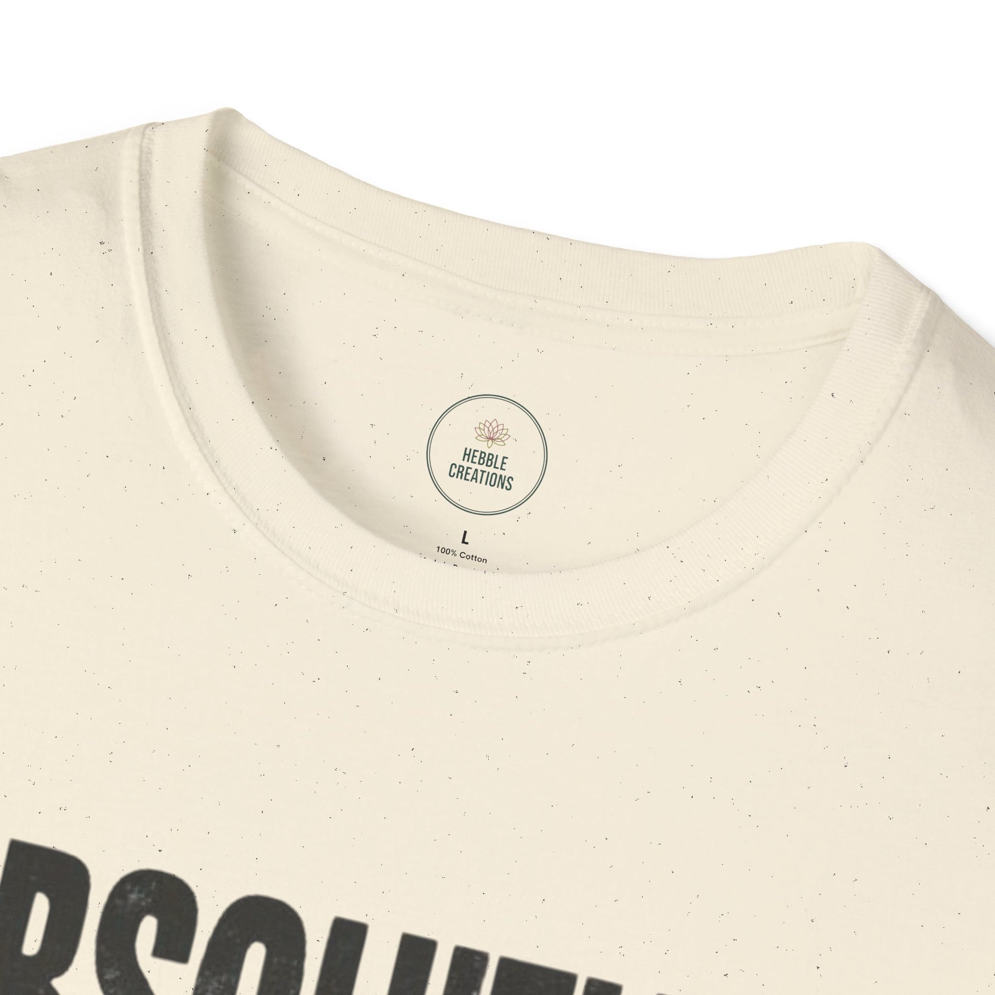 Close-up of a beige t-shirt with a logo on the collar and text at the bottom.
