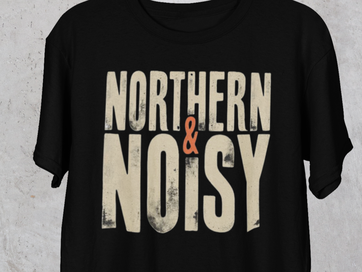 Black t-shirt with 'Northern & Noisy' text on a textured gray background