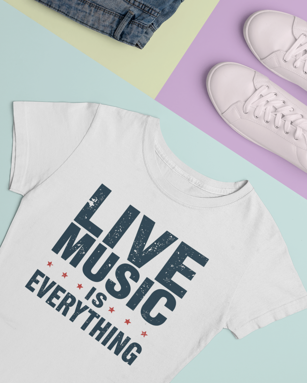 White t-shirt with 'Live Music is Everything' text on a colorful background with jeans and sneakers.