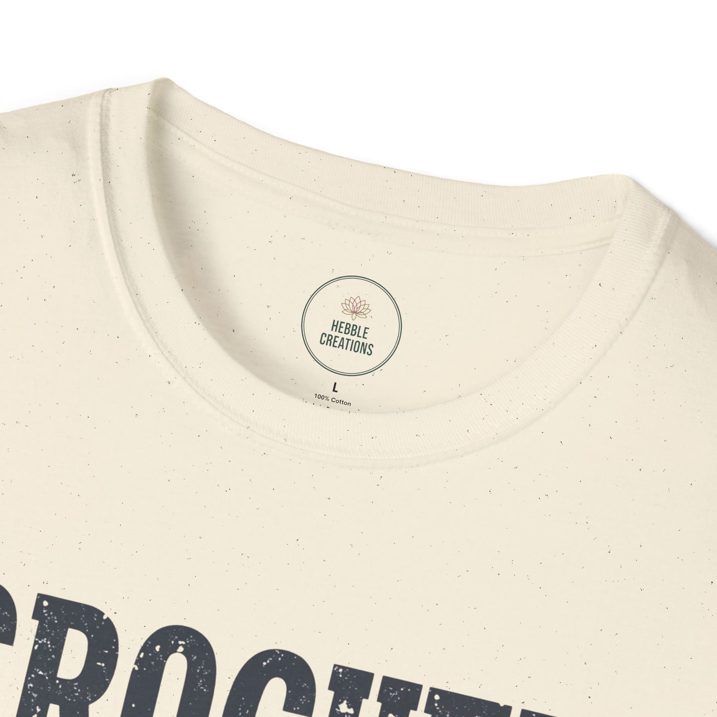 Close-up of a beige t-shirt with a brand label on a white background