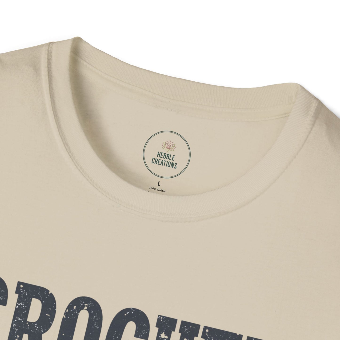 Beige t-shirt with 'Hedley Creations' label on a white background